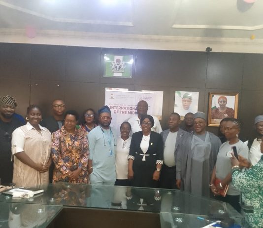 Front row: (L-R): Madam Favour Adams representative of Engender Health, Muriel Mafico, Resident Representative, UNFPA, Dr. Jibrin Kasim, representative of Country Representative WHO, Dr. Imaobong Umah, Director, Nursing Division, Dr. Abisola S. Adegoke, representing Coordinating Minister of Health and Social Welfare Professor Muhammad Ali Pate, Dr. Okpako Okpikpi, representing Permanent Secretary, Daju Kachollom, Dr. Alhasan Ndagi, Registrar/CEO, Nursing and Midwifery Council of Nigeria, and Dame Francisca, Director, Regulatory bodies