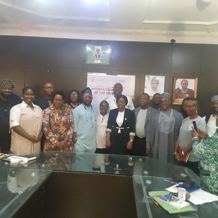 Front row: (L-R): Madam Favour Adams representative of Engender Health, Muriel Mafico, Resident Representative, UNFPA, Dr. Jibrin Kasim, representative of Country Representative WHO, Dr. Imaobong Umah, Director, Nursing Division, Dr. Abisola S. Adegoke, representing Coordinating Minister of Health and Social Welfare Professor Muhammad Ali Pate, Dr. Okpako Okpikpi, representing Permanent Secretary, Daju Kachollom, Dr. Alhasan Ndagi, Registrar/CEO, Nursing and Midwifery Council of Nigeria, and Dame Francisca, Director, Regulatory bodies