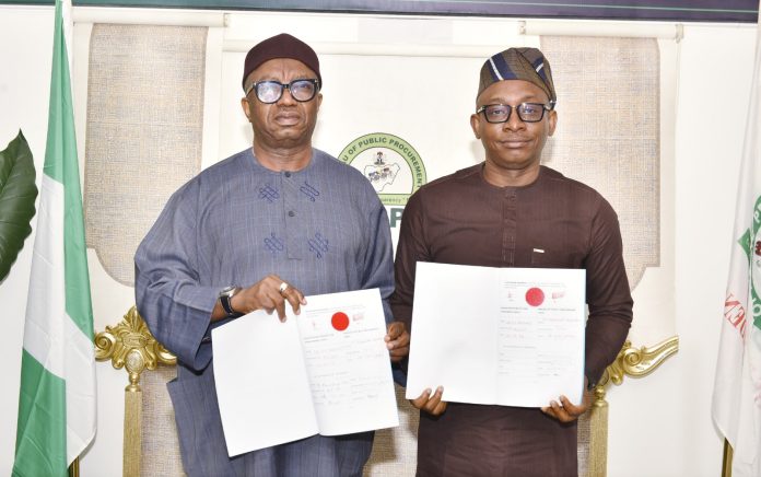 R-L: Director-General, Bureau of Public Procurement (BPP), Dr. Adebowale A. Adedokun, FCIPS and National Commissioner/CEO, National Data Protection Commission (NDPC), Dr. Vincent Olatunji displaying the copies of the signed Memorandum of Understanding (MoU) by BPP and NDPC in Abuja