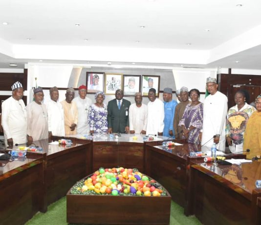 The Representative of the Minister of State for Agriculture and Food Security/ Permanent Secretary in the Ministry, Dr Marcus Olaniyi Ogunbiyi (C) and Members of the Ministerial Technical Committee on RH- CRRP.