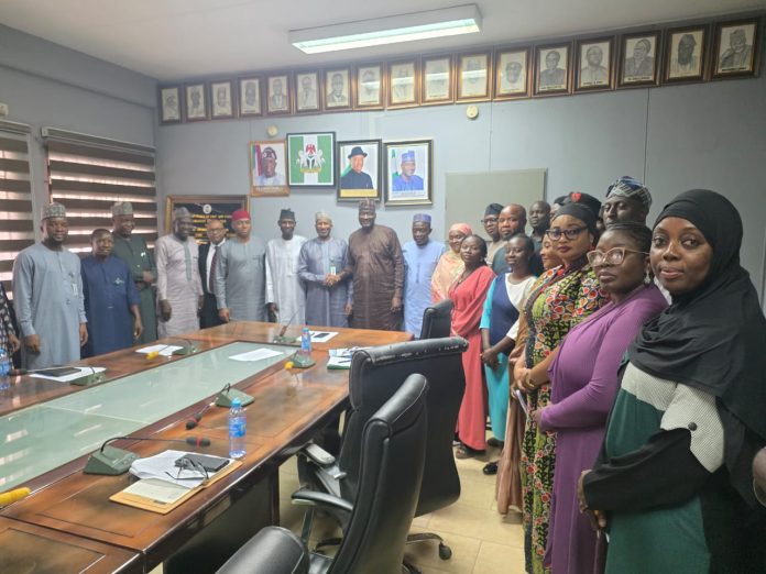 Group Photograph taken during the Inauguration of the Reconstituted Project Management Team (PMT) for the Implementation of Enterprise Content Management (ECM) held at the Permanent Secretary Conference Room, Abuja.