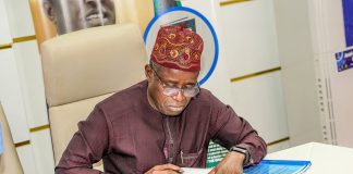 The Permanent Secretary, signing the contract aggrement