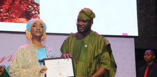 The Honourable Minister of Federal Ministry of Art, Culture Tourism and Creative Economy, Barr Musa Musawa receiving her certificate by the Director General/ Chief Executive Officer of NIHOTOUR during the induction and certification ceremony recently at Merit House, Abuja.