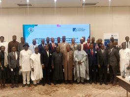 (7th right) The representative of the Secretary to the Government of the Federation and Permanent Secretary (GSO) Dr. Ibrahim Abubakar Kana mni in a group photograph with participants of the Induction Programme for Chief Executive Officers, Chairmen and members of Governing Boards of Parastatals, Agencies and Commissions inaugurated by the Federal Government taking place in Abuja.