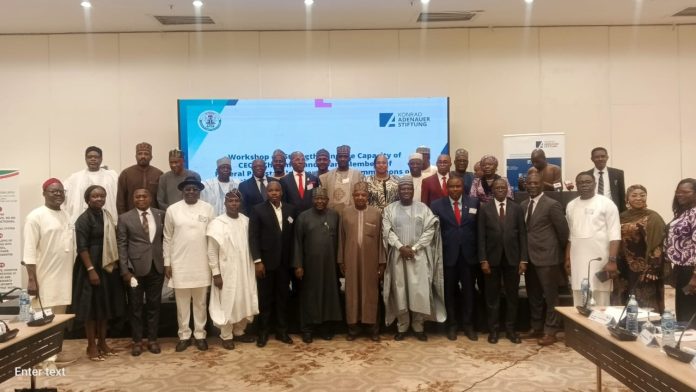 (7th right) The representative of the Secretary to the Government of the Federation and Permanent Secretary (GSO) Dr. Ibrahim Abubakar Kana mni in a group photograph with participants of the Induction Programme for Chief Executive Officers, Chairmen and members of Governing Boards of Parastatals, Agencies and Commissions inaugurated by the Federal Government taking place in Abuja.