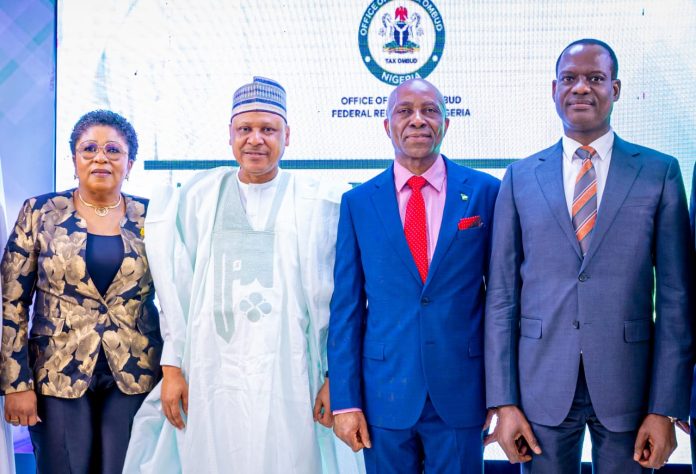 (L–R) The Head of the Civil Service of the Federation, Mrs. Didi Esther Walson-Jack; the Honourable Minister of Information and National Orientation, Mohammed Idris, fnipr; Chairman/Chief Executive Officer, Office of the Tax Ombud Nigeria, Dr. John C. Nwabueze; and the Honourable Minister of Finance and Coordinating Minister of the Economy, Mr. Taiwo Oyedele, during the unveiling of the official website and launch of the toll-free call centre and case management system of the Office of the Tax Ombud Nigeria, held on May 18, 2026, in Abuja. Photo: Khalid Ahmed/FMINO