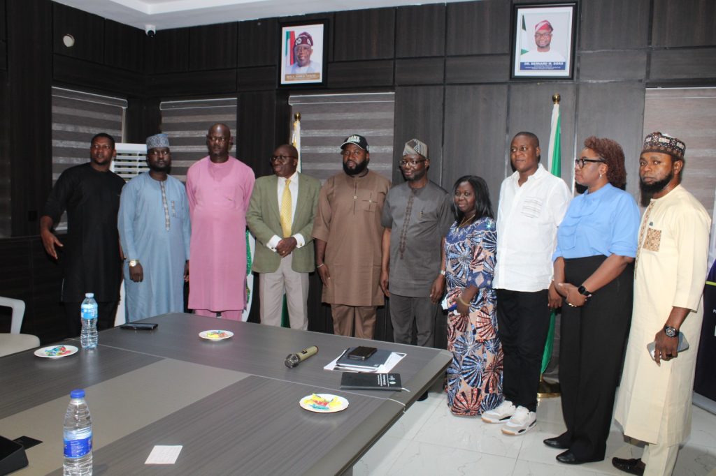Group picture with the executive members of NANS when they visited the Honourable Minister of Humanitarian Affairs and Poverty Reduction. Dr. Bernard M. Doro in his office.