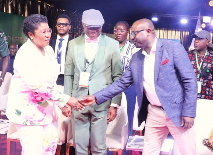 The Honourable Minister of Interior, Olubunmi Tunji-Ojo exchanging handshakes with the Head of the Civil Service of the Federation, Mrs Didi Esther Walson-Jack