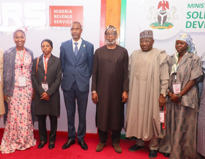 L-R: Special Assistant to Minister of Sold Minerals Development Amira Waziri, Executive Director, Large Tax Group, Amina Ado, Permanent Secretary, Ministry of Sold Minerals Development, Permanent Secretary, Ministry of Solid Minerals Development, Faruk Yusuf Yabo , Minister of Solid Minerals Development, Dr. Dele Alake; Executive Director, Finance and Corporate Services Nigeria Revenue Service, Alhaji Lawal Abubakar and Group Director, Non-Tax Revenue, Hauwa Ibrahim during the NRS–MSMD Joint Stakeholder Sensitization (North Central) titled “From Resource to Revenue: Aligning Solid Minerals Operations with the 2025 Tax Reform Act,” organised by the Nigeria Revenue Service and the Federal Ministry of Solid Minerals Development in Abuja on May 20, 2026.