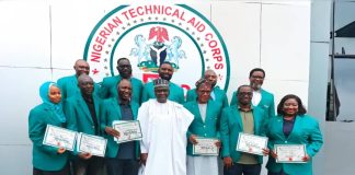 The Director-General, Nigerian Technical Aid Corps, Rt. Hon. Yusuf Buba Yakub (M) flanked by the 11 Returning Volunteers from Uganda at the Debriefing Exercise held at the NTAC Complex *25th May, 2026*