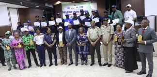 Minister of Interior, Dr. Olubunmi Tunji-Ojo (middle), Permanent Secretary of Ministry of Interior, Dr. Magdalene Ajani (6th right), with guests and awards during the maiden edition of the Ministry of Interior Innovation and Challenge Award Ceremony and joint Union Council (JUC) Week celebration in Abuja.