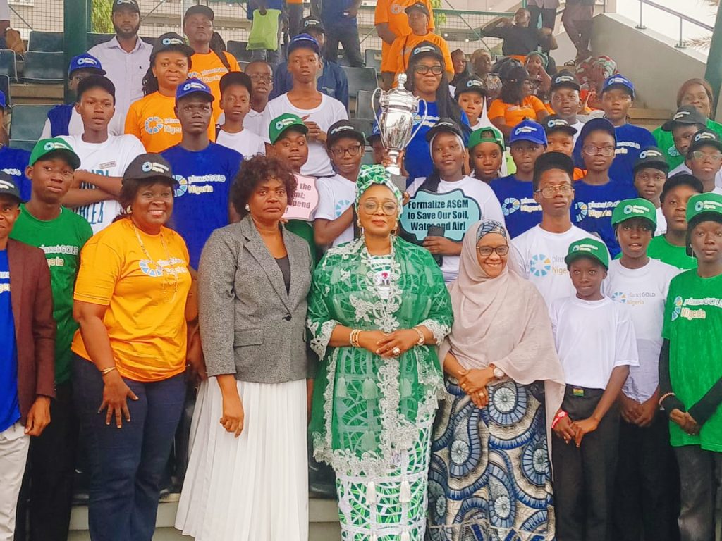 The Honourable Minister of Women Affairs and Social Development, Hajiya lmaan Suleiman-Ibrahim fsi (middle), the Permanent Secretary, Federal of Women Affairs and Social Development, Mrs.Esuabana Nko Asanye (1st left) and the presentation of the  Honourable of the Federal Capital Territory Administration,  Barrister Nyesom Wike, Hajiya Asmau Mukhtar, Esq, Permanent Secretary/Acting Mandate Secretary, Women Affairs Secretariat FCTA, (1st right) in a group photogragh with School Children during the event held at the Eagle  Square, Abuja.