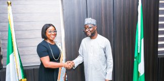 The Honourable Minister of Humanitarian Affairs and Poverty Reduction.Dr. Bernard M. Doro in a handshake with the leader of the delegation the CEO. Enhancing Financial Inclusion and Advancement (EFInA) Foyinsolami Akinjayeju during the visit.