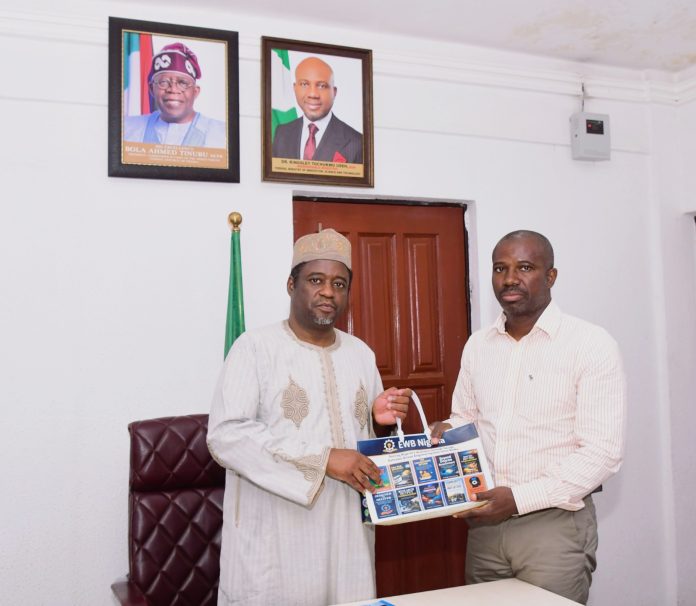 Permanent Secretary, Federal Ministry of Innovation, Science and Technology FMIST, Dr. Mukhtar Yawale Muhammad, mni () receiving a compendium outcome Driven Engineering Education books from the Executive Director, Engineers Without Boarders (EWB) Nigeria Mr. Oladimeji Olutimehin (right) during the visit.