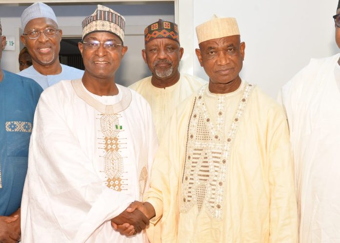 The Honourable Minister Federal Ministry of Livestock Development, Idi Mukhtar Maiha in a handshake with the Lead Delegation Al- Mustafa OFR