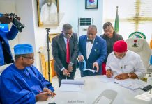 Hon. Minister of State for Health and Social Welfare Dr Iziaq Adekunle Salako watching his Excellency, Governor of Imo State Senator Hope Uzodimma signing MoU between the Health Ministry and Imo State Government for takeover and Upgrade of General Hospital Okigwe to a Federal Medical Center, Okigwe.
