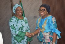 The Ag. National Coordinator/CEO of the SERVICOM Office, Mrs. Helen Lawal decorating the Director SERVICOM, Hajiya Aisha Muhammed as the Nodal Officer for NRS during the Inauguration.