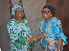 The Ag. National Coordinator/CEO of the SERVICOM Office, Mrs. Helen Lawal decorating the Director SERVICOM, Hajiya Aisha Muhammed as the Nodal Officer for NRS during the Inauguration.