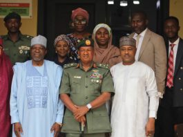 Director-General of the NBC, Surveyor Adamu Adaji, and some Directors of the Commission posed for a group photograph with Brigadier General M.B. Shehu and his team, after the meeting.