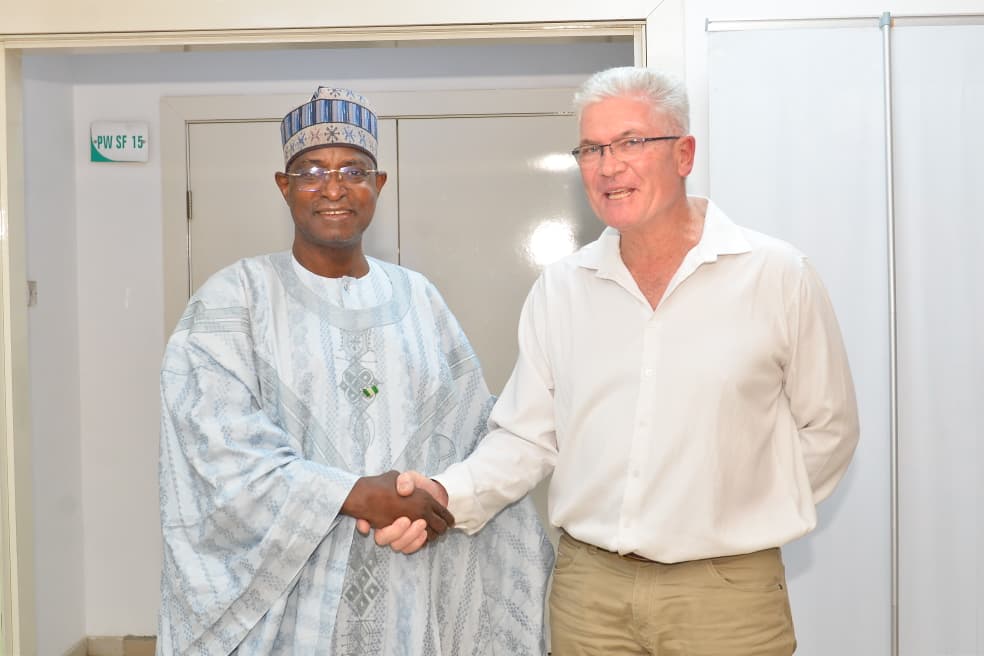 The Honourable Minister of Federal Ministry of Livestock Development, idi Mukhtar Maiha in a handshake with the Managing Director/CEO Valentine Chickens.