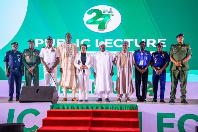 IMG-20260611-WA0103 (M) Secretary to the Government of the Federation, Sen. George Akume, CON, (to his left) the Head of the Civil Service of the Federation, Mrs. Didi Esther Walson-Jack, OON, Director-General of the National Institute for Policy and Strategic Studies (NIPSS), Prof. Ayo Omotayo, in a group photograph with Service Chiefs during the 27th Democracy Anniversary Public Lecture at the State House Banquet Hall, Abuja.