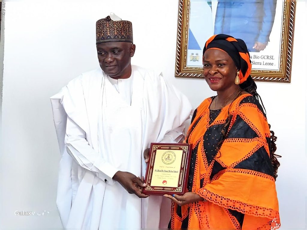 *DG/CEO, Nigerian Technical Aid Corps (NTAC), Rt. Hon. Yusuf Buba Yakub,* presenting a commemorative plaque to the *Honourable Minister of Technical and Higher Education of Sierra Leone, Dr. Haja Ramatulai Wurie* , during the bilateral engagement in Freetown.