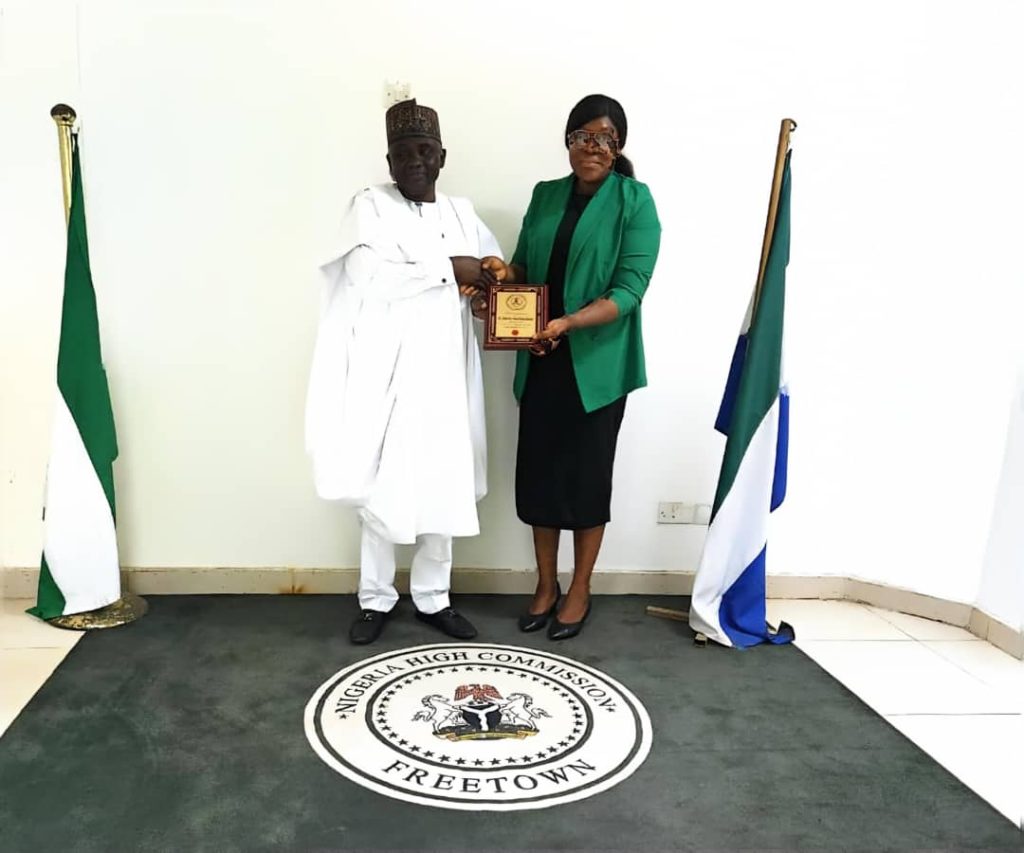 *DG/CEO, Nigerian Technical Aid Corps (NTAC), Rt. Hon. Yusuf Buba Yakub* , presenting a commemorative plaque to the *Head of Chancery, Nigerian High Commission, Sierra Leone, Mrs. Ivie Okojie-Imarah,* during the NTAC delegation's visit to Freetown.