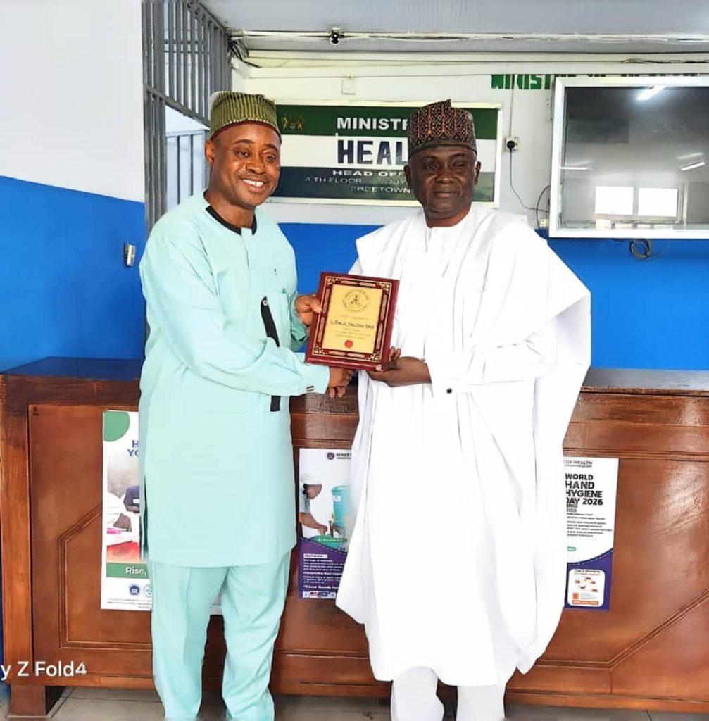 *DG/CEO, Nigerian Technical Aid Corps (NTAC), Rt. Hon. Yusuf Buba Yakub,* presenting a commemorative plaque to the *Deputy Minister of Health of Sierra Leone, Prof. Charles Seusse,* during a bilateral engagement visit in Freetown.