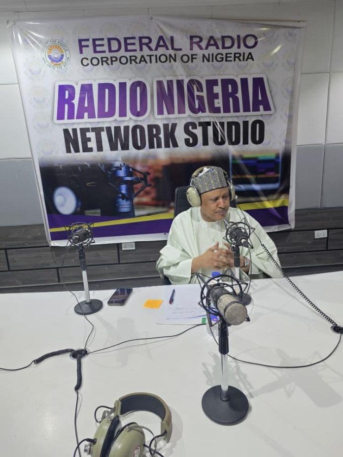 IMG-20260613-WA0171 Honourable Minister of Information and National Orientation, Mohammed Idris, FNIPR, speaking on Radio Nigeria’s Radio Link programme on the Tinubu Administration’s commitment to security, prosperity, and the dividends of democracy.