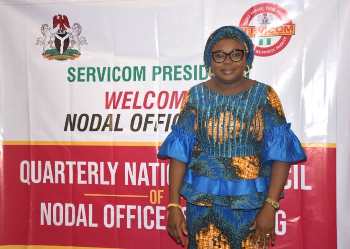 IMG-20260619-WA0001 The Ag. National Coordinator/CEO of the SERVICOM Office, Mrs. Helen Lawal poses for a photograph during the 2nd Quarter National Council of Nodal Officers Meeting at the Conference Hall of the Federal Capital Development Administration (FCDA), Abuja, on 18th June 2026