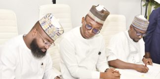 Director-General/CEO, Bureau of Public Procurement (BPP), Dr. Adebowale A. Adedokun, FCIPS (m) watches with keen interest while the Executive Vice Chairman/CEO, National Agency for Science and Engineering Infrastructure (NASENI), Mr. Khalil Suleiman Halilu and Managing Director/CEO, Rural Electrification Agency (REA), Mr. Abba Abubakar Aliyu sign the MoU in Abuja