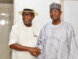 The Honourable Minister of Livestock Development, Idi Mukhtar Maiha in a handshake with the Chairman/ CEO Chromedix Pharmaceuticals company, Sir Emeka Offor