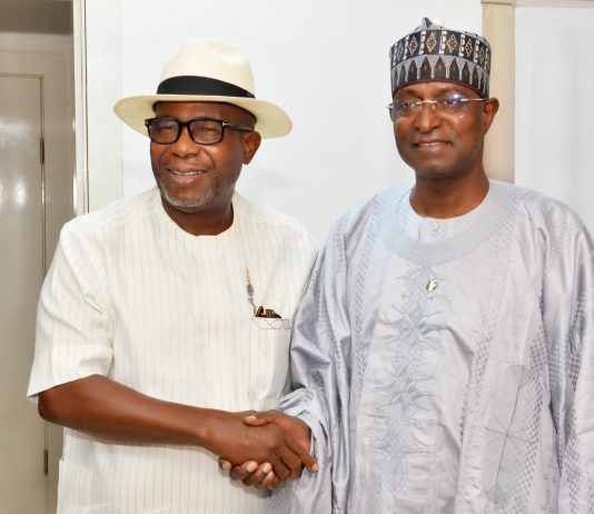 The Honourable Minister of Livestock Development, Idi Mukhtar Maiha in a handshake with the Chairman/ CEO Chromedix Pharmaceuticals company, Sir Emeka Offor