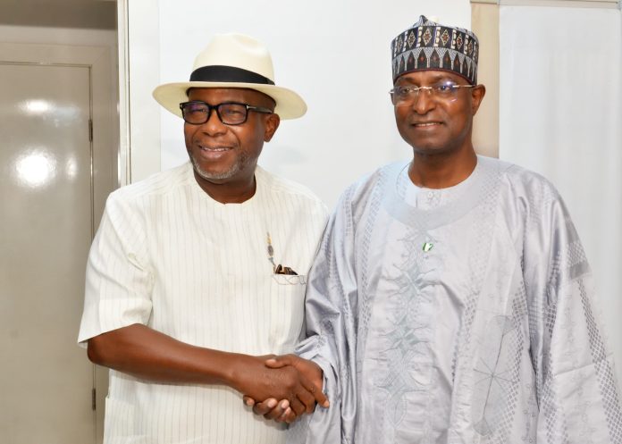 The Honourable Minister of Livestock Development, Idi Mukhtar Maiha in a handshake with the Chairman/ CEO Chromedix Pharmaceuticals company, Sir Emeka Offor