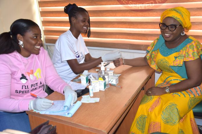 The Ag. National Coordinator/CEO Mrs. Helen Lawal checking her vital signs during the health awareness talk and check organized by the SERVICOM Office at the Conference Room of the organisation in Abuja today 25th June, 2026.