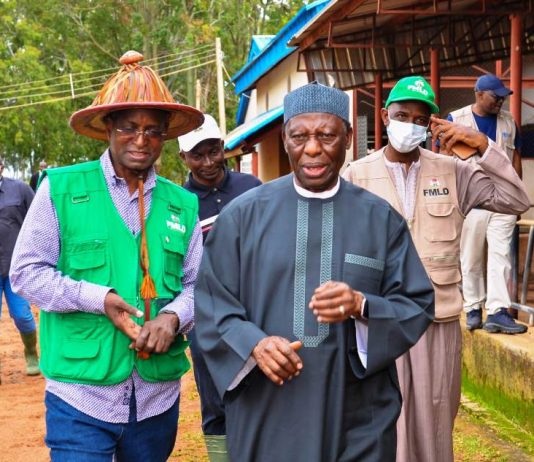 The Honourable Minister Idi Mukhtar Maiha with the Founder of Integrated dairy Ltd, AVM Ishaya Shekarri Rtd during the Facility tour of the Farm in Vom, Plateau State.