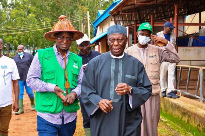The Honourable Minister Idi Mukhtar Maiha with the Founder of Integrated dairy Ltd, AVM Ishaya Shekarri Rtd during the Facility tour of the Farm in Vom, Plateau State.