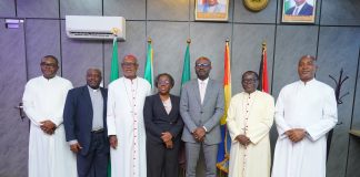 3rd Left - Hon. Minister of Interior, Dr Olubunmi Tunji-Ojo; Permanent Secretary, Ministry of Interior, Dr. Magdalene Ajani (4th left); Bishop Matthew Kukah (2nd left) along with other members of the delegation in a group photograph during the courtesy visit in Abuja on Tuesday.
