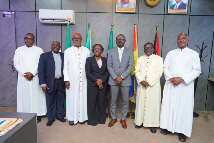 IMG-20260701-WA0021 3rd Left - Hon. Minister of Interior, Dr Olubunmi Tunji-Ojo; Permanent Secretary, Ministry of Interior, Dr. Magdalene Ajani (4th left); Bishop Matthew Kukah (2nd left) along with other members of the delegation in a group photograph during the courtesy visit in Abuja on Tuesday.