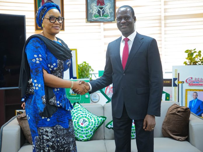 IMG-20260703-WA0099 Caption: L:R: Director General of PTAD, Mrs Tolulope Odunaiya in a warm handshake with the Minister of Finance, Mr Taiwo Oyedele.