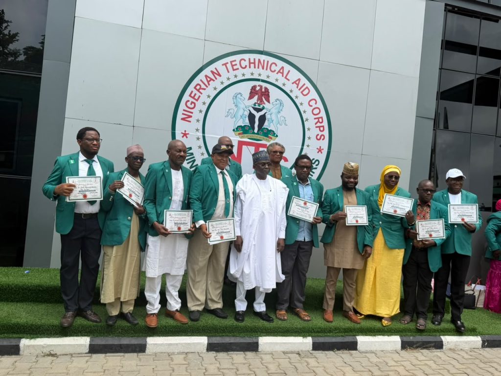 Rt. Hon. Yusuf Buba Yakub, Director-General/Chief Executive Officer, Nigerian Technical Aid Corps (NTAC), in a group photograph with returning NTAC Volunteers from The Gambia during their Debriefing and Support Session held at the NTAC Conference Room, Abuja, *1st July, 2026.*