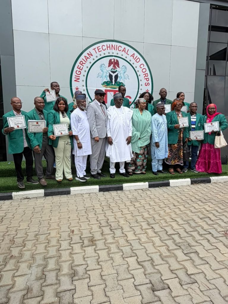 Rt. Hon. Yusuf Buba Yakub, DG/CEO, NTAC (centre), flanked by the Director of Programmes, Amb. Bello A. Jaye; President, Civil Society Organisations of Nigeria (CSO), Abuja Chapter, Comrade Dominic Ogakwu (right); Deputy Director (Accounts), Mrs. Meimunat Haruna; Amb. Ombugadu Aloko (left), Resource Person, in a group photograph with the returning NTAC Volunteers from Sierra Leone during the Debriefing and Support Session held on *1st July, 2026.*