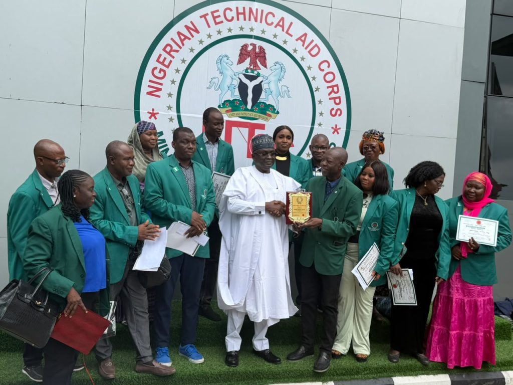 Rt. Hon. Dr. Yusuf Buba Yakub, Director-General/Chief Executive Officer, Nigerian Technical Aid Corps (NTAC), receiving an *Award of Merit* from the returning NTAC Volunteers from Sierra Leone during the Debriefing and Support Session held on *1st July, 2026.*