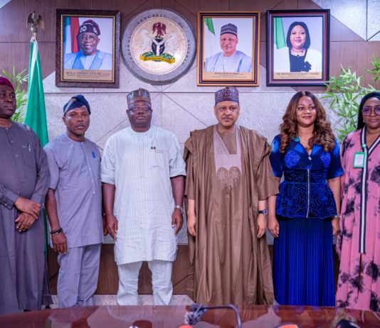 (R–L) Director of Operations, National Identity Management Commission (NIMC), Mr. Uche Chigbo; Director-General/Chief Executive Officer, National Identity Management Commission (NIMC), Engr. Abisoye Coker-Odusote; Honourable Minister of Information and National Orientation, Mohammed Idris, fnipr; Director-General, National Orientation Agency (NOA), Mallam Lanre Issa-Onilu; Acting Permanent Secretary, Federal Ministry of Information and National Orientation, and Director, Production, Publication and Documentation Department (PPDD), Mr. Ibidapo Okunnu; and Director, Public Relations and Protocol Department (PRPD), Dr. Suleiman Haruna, during a courtesy visit by the Director-General of the National Identity Management Commission (NIMC) to the Honourable Minister on July 8, 2026, in Abuja. Photo: Khalid Ahmed/FMINO.