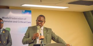 Dr. Iziaq Adekunle Salako delivering his keynote Address at the 11th Intensive and Critical Care Society of Nigeria Conference and Annual General Meeting, tagged "Abuja 26"