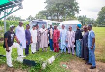 Representative of the Secretary to the Government of the Federation and Permanent Secretary (General Services Office), Dr. Ibrahim Abubakar Kana, mni, (6th left) flanked by some Management Staff of OSGF and Benue State APC Stakeholders as he handes over the keys of the two buses donated by SGF, Sen. George Akume CON to the Chairman of Joint Council of Unions in the Office of the Secretary to the Government of the Federation, Comrade Paul Idowu on Friday, 10th July, 2026 in Abuja.