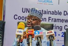 The Honourable Minister of Humanitarian Affairs and Poverty Reduction Dr. Bernard M. Doro presenting his address at the UN house today during the meeting.