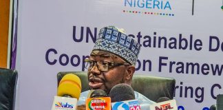 The Honourable Minister of Humanitarian Affairs and Poverty Reduction Dr. Bernard M. Doro presenting his address at the UN house today during the meeting.
