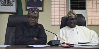 The RMAFC Chairman, Dr Mohammed Bello Shehu OFR addressing the INEC Chairman during the visit
