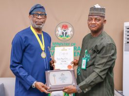 Minister of Solid Minerals Development, Dele Alake (left), and the Director-General of the Advertising Regulatory Council of Nigeria (ARCON), Dr. Olalekan Fadolapo, during the conferment of an Honorary Fellowship by ARCON on the Minister at the Ministry of Solid Minerals Development headquarters in Abuja on July 15, 2026.